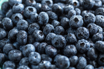 Fresh juicy blueberries background. Flat lay top view copy space. Healthy berry, organic food, antioxidant, vitamin, blue food