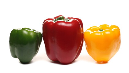 Different color bell peppers isolated on white background