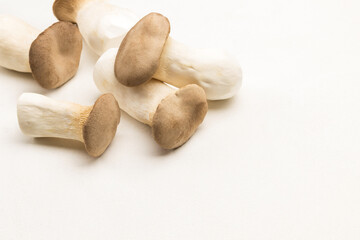 Fototapeta na wymiar Bunch of king oyster mushrooms on table.