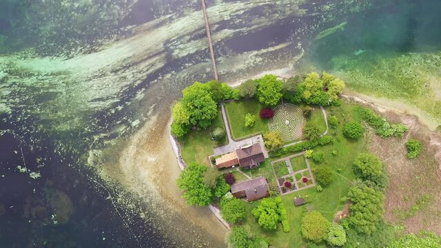 Upward aerial drone footage of a small island on the Rhine river near the Stein am Rhein old town in canton Schaffausen in Switzerland