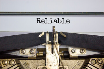 Reliable symbol. The word 'reliable' typed on retro typewriter. Business, reliable concept....