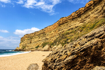 Crystal clear and wild waters in Praia da Foz, Sesimbra, Portugal