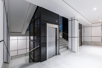 Interior photography, contemporary corridor hall business center in white tiles with Marble © Liubomir