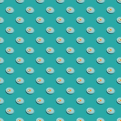 Pattern with many fried eggs on plates