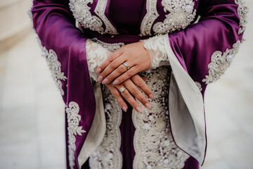 Fototapeta na wymiar bride and groom holding hands rings