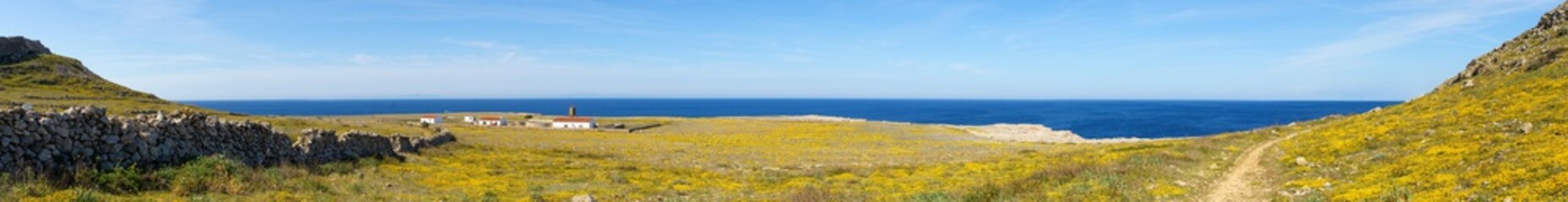 Panoramic view of the west coast of Menorca in a sunny day with blue sky (Balearic Islands, Spain)