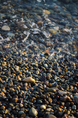 Waves on sea pebbles.
