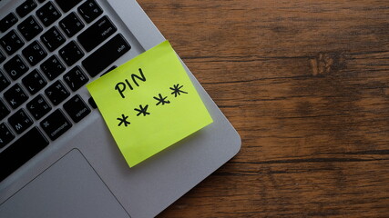 Strong and weak easy PIN Password on laptop background.