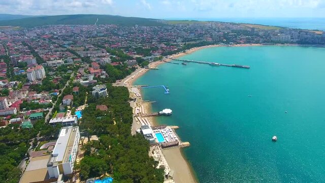 Aerial view tourist city of Gelendzhik, Black Sea coast beaches and part of city panorama 4K