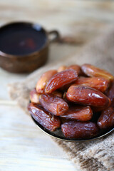 A cup of date tea. Dried dates. Arabic drink. Ramadan.