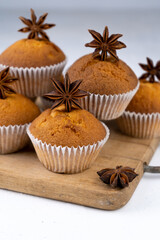 Biscuit muffins close-up. Sweet pastries. Party treat. Dessert on white table - homemade muffins. Portioned cupcakes. Simple muffin
