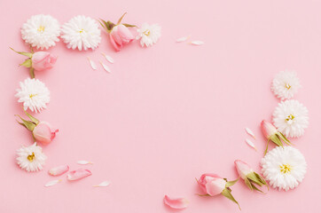 Fototapeta na wymiar pink and white flowers on pink paper background