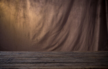background of brown fabric and wooden table