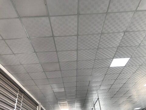 Suspended False ceiling interiors design for an Large open area office building for an workstations