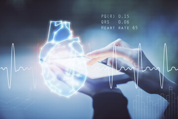 Double exposure of heart sketch hologram and woman holding and using a mobile device. Medical education concept.