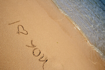 Beautiful drawing on the sand of the sea background