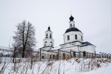 orthodox church made of white brick in winter