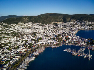 Amazing panoramic view from drone of beautiful full of yachts Bodrum harbour and ancient Kalesi castle in Mugla province in Turkey
