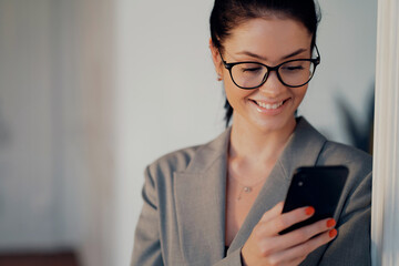 Portrait of a lawyer businesswoman with glasses of European appearance. A finance assistant is...