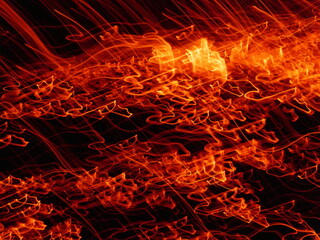 Fire flames with sparks on a black background.By shooting at high speed.