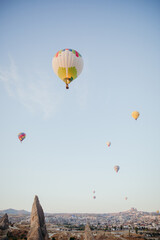Fototapeta na wymiar Huge balloons in the panorama of Cappadocia.