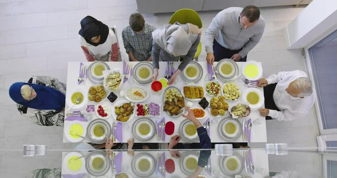 Muslim family gathering for having Iftar in Ramadan together top view