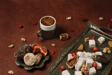 Authentic turkish coffee cup arranged with dried fruits