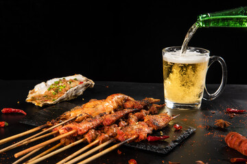 Shashlik. Kebab. Grilled barbecue meat with beer