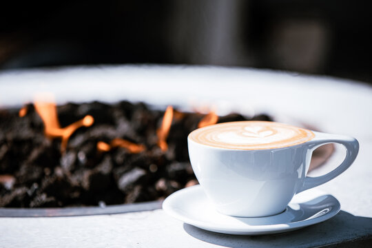 Cup of coffee on fireplace