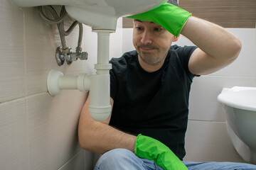 Drain Problems, blockage male floor tired sink pipe bathroom repair draining