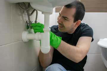 Drain Problems, blockage male floor tired sink pipe bathroom repair draining