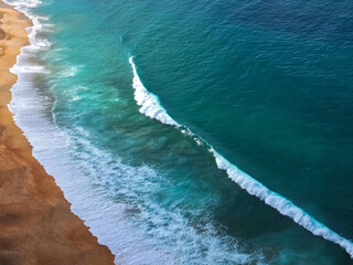 Wonderful aerial view of beach and waves at Nazare in Portugal