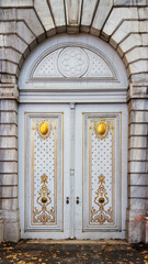 Historic white gate decorated with gold pattern. View from Dolmabahce street in Besiktas district of Istanbul, Turkey