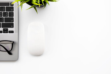 White office desk table with laptop computer and office supplies. Top view with copy space, flat...