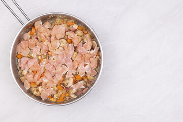 Cooking mushrooms with onions carrots and bacon