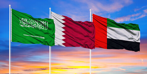 Flags of Qatar, the United Arab Emirates and Saudi Arabia. The blockade of Qatar