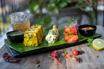 Vegetarian diet food, Grilled paneer cheese and vegetables kebab, indian style Paneer Tikka, with white sauce and lime