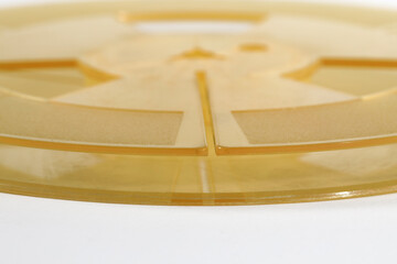 Empty plastic spool without rolled tape