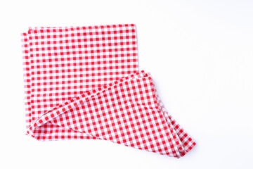 Red and white tablecloths crumpled on white the table. Cloth on white background top view and with copy space.
