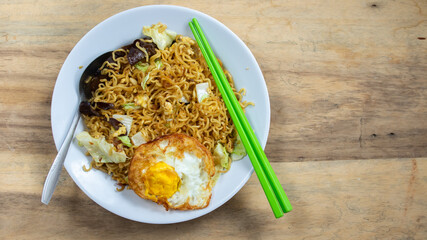 fried noodles with vegetable and egg.  this food is so popular and one of most favorite indonesian food that called 