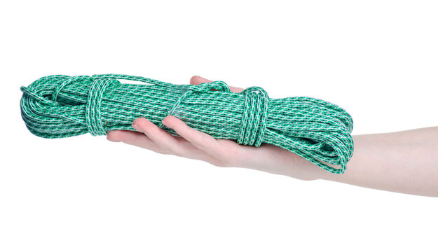 green paracord rope in hand on white background isolation