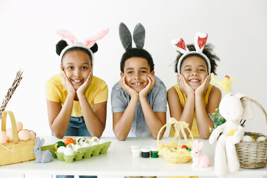 Happy kids posing for a photo in rabbit ears