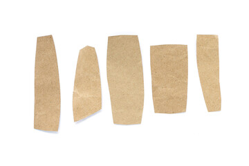 Recycled paper craft stick on a white background. Brown paper torn or ripped pieces of paper isolated on white background.