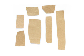 Recycled paper craft stick on a white background. Brown paper torn or ripped pieces of paper isolated on white background.