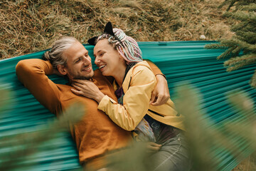 Fototapeta premium couple in love enjoying each other and walking in the mountains