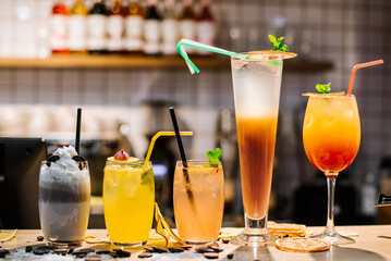 Different sweet colored cocktails on the bar table