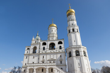 Fototapeta na wymiar Bell tower Ivan the Great (Velikiy) in Moscow Kremlin with blue sky
