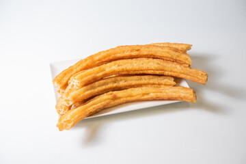 Churros. Porras. Typical spanish churros on white background.