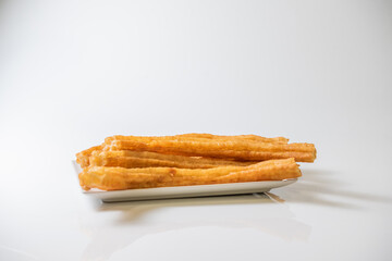 Churros. Porras. Typical spanish churros on white background