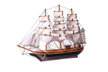The wooden ship model with white sails on the white background